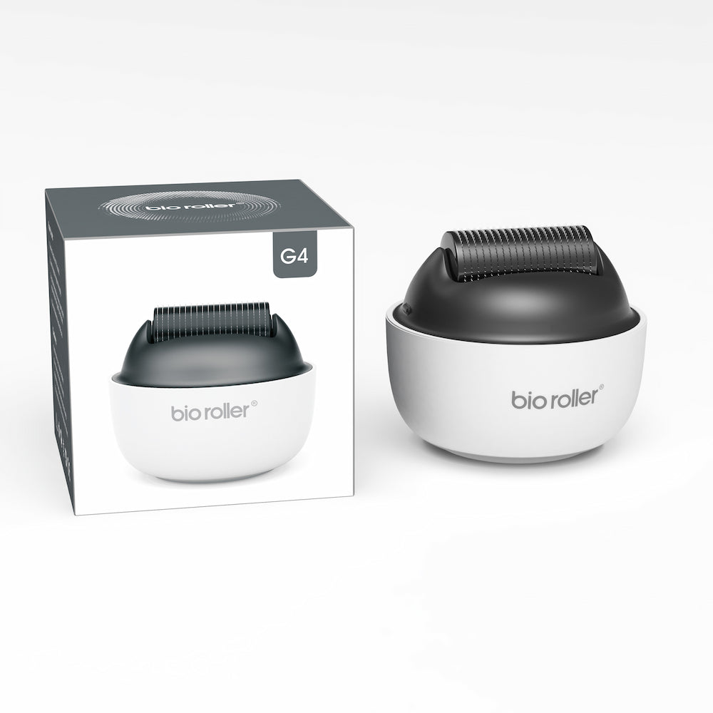 Bio Roller G4 microneedling-Rolle zusammen mit der Produktverpackung, entworfen für Gesichtsbehandlung, Hautverjüngung und verbesserte Serumabsorption.